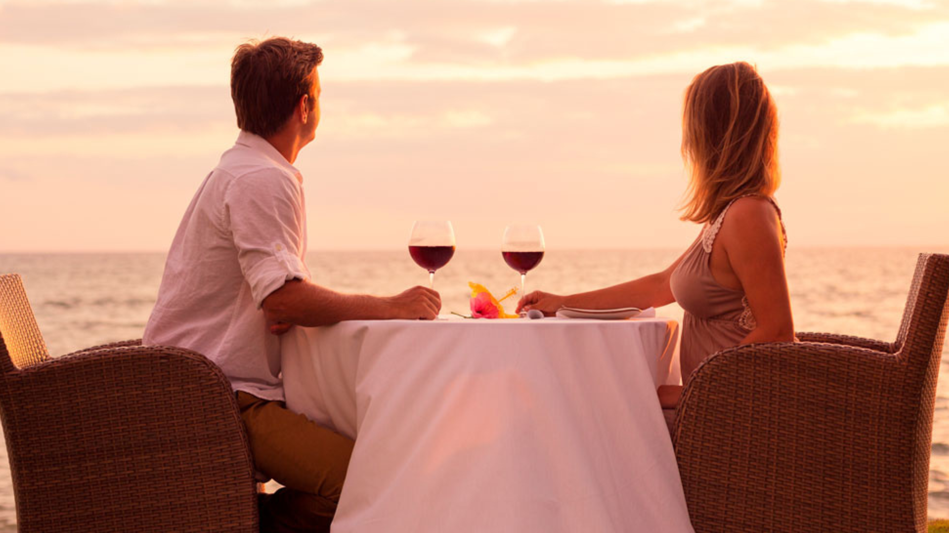 Couple having a private dinner date by the beach