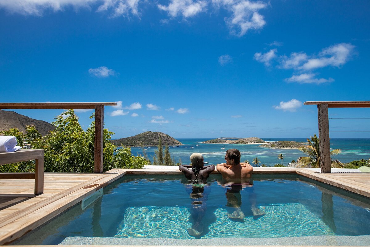 A couple in a swimming pool on vacation in Saint Martin