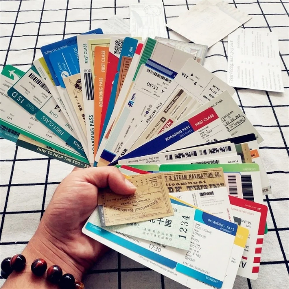 A woman holding old boarding passes